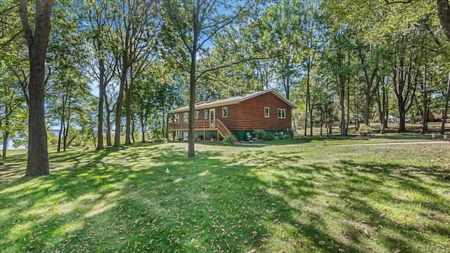 view of yard with a wooden deck