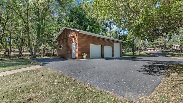 garage featuring a yard