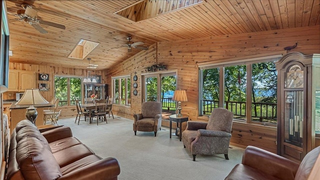 living room featuring wooden walls and ceiling fan