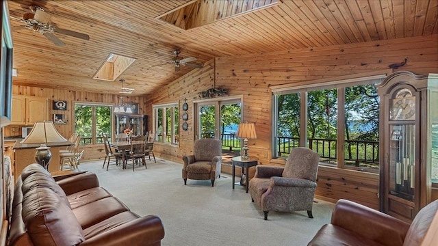 15520 Tamarac Cir NE, Miltona, MN 56354 - living area with carpet, wood ceiling, wood walls, and a ceiling fan