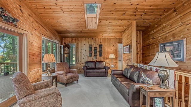 living room with light carpet, a skylight, wood ceiling, and wood walls