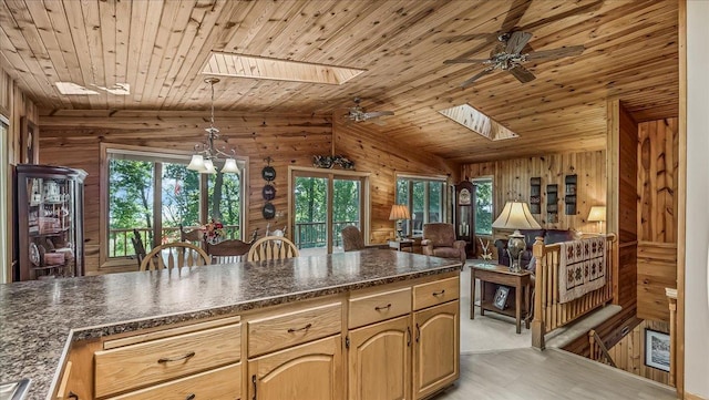 15520 Tamarac Cir NE, Miltona, MN 56354 - kitchen featuring wooden walls, dark countertops, and wooden ceiling