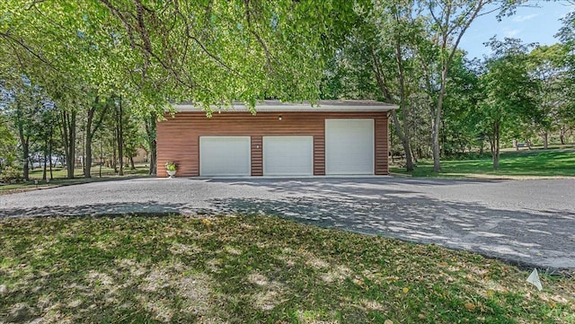 garage with a yard