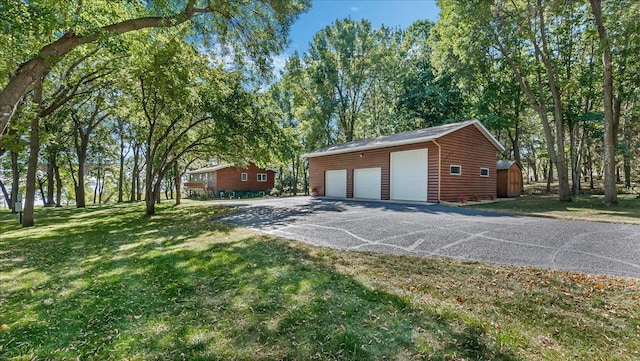 garage with a lawn