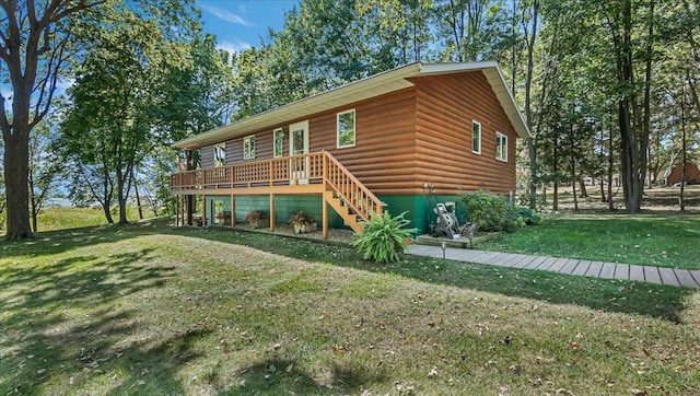 log home with a deck and a front lawn