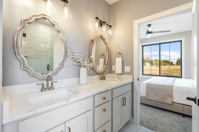 bathroom with vanity, walk in shower, and ceiling fan