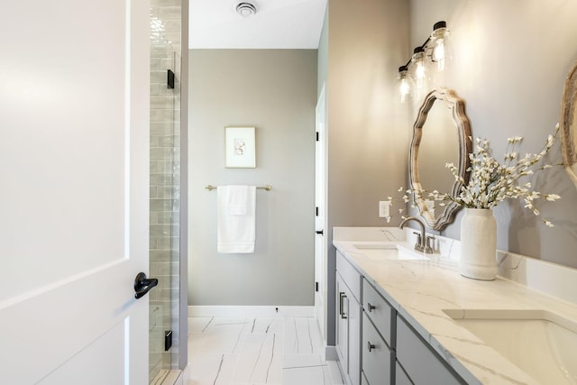 bathroom featuring vanity and an enclosed shower