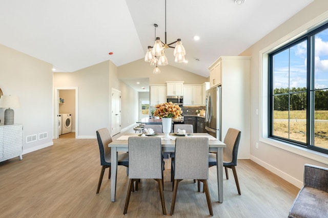 dining area with a healthy amount of sunlight, an inviting chandelier, and light wood-type flooring