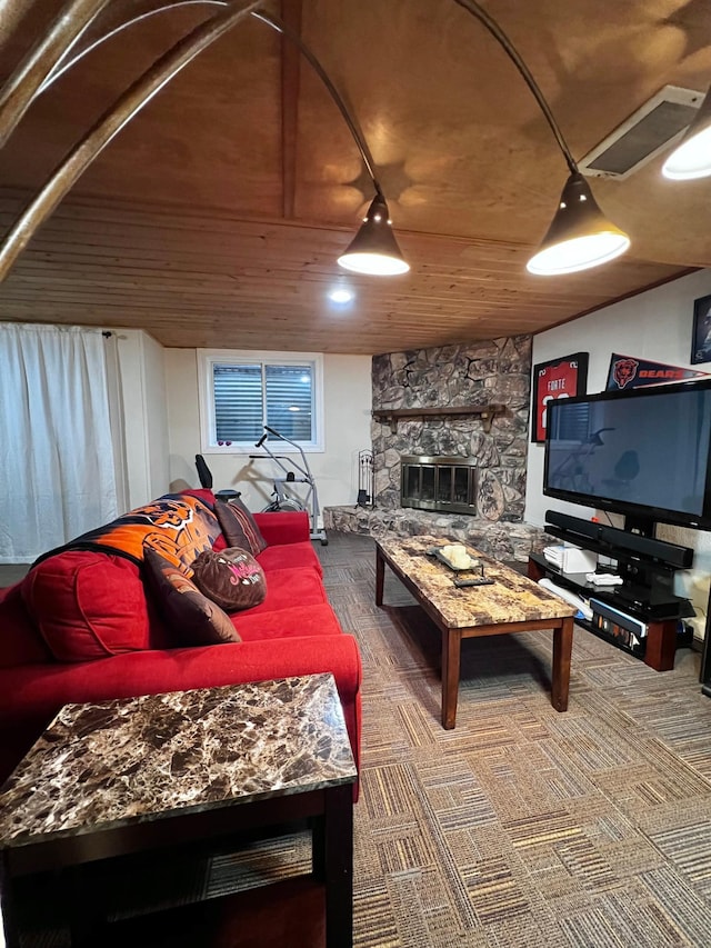 living room featuring a fireplace, carpet floors, and wood ceiling