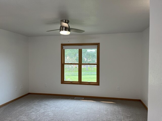 carpeted empty room with ceiling fan