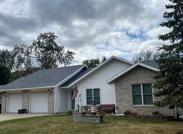 view of front of home with a garage and a front yard