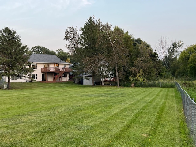 view of yard featuring a wooden deck