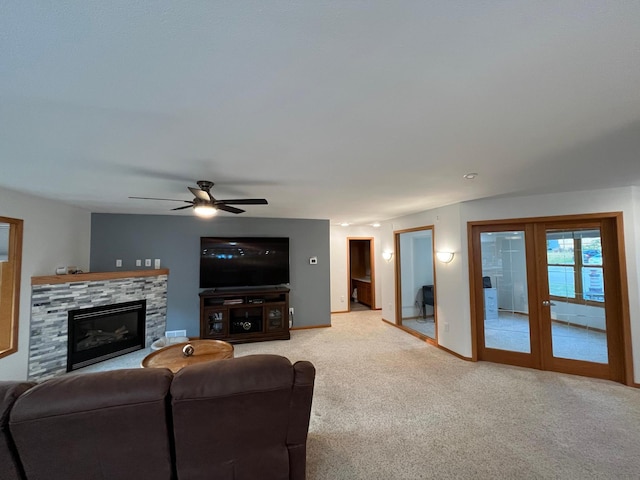 carpeted living room with ceiling fan