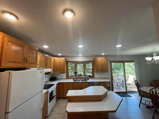 kitchen with ventilation hood, light tile patterned floors, white appliances, and a center island