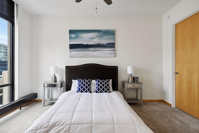 bedroom featuring carpet, baseboards, and ceiling fan