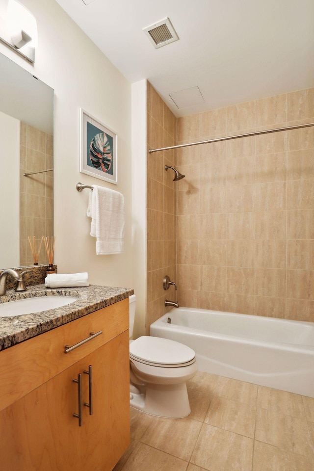 full bathroom featuring vanity, visible vents, tile patterned flooring, shower / washtub combination, and toilet