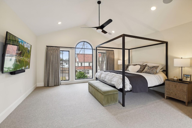 bedroom with ceiling fan, light colored carpet, and high vaulted ceiling