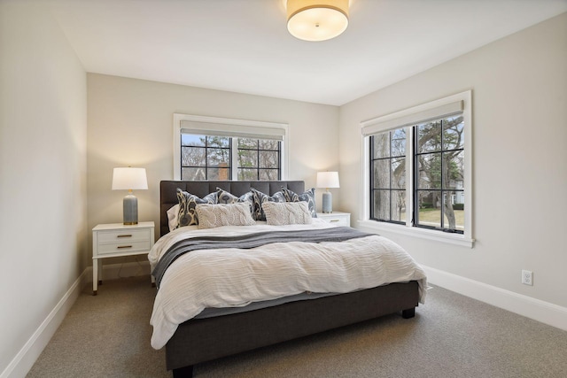 carpeted bedroom featuring multiple windows