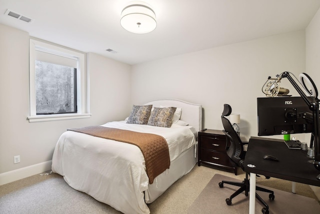 bedroom featuring light carpet