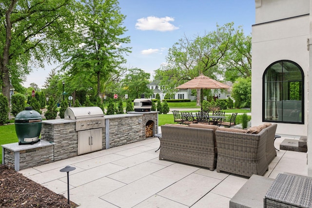 view of patio featuring an outdoor kitchen, a grill, and an outdoor hangout area