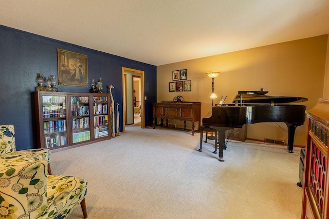 sitting room featuring carpet flooring