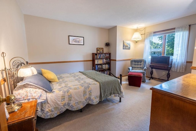 bedroom with light colored carpet