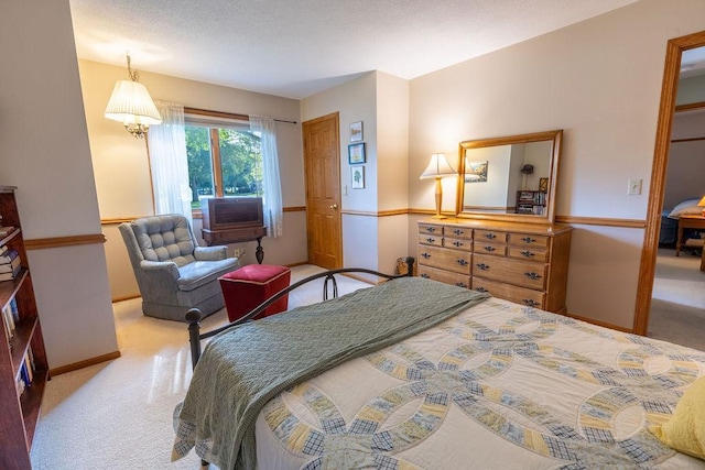 bedroom featuring cooling unit and light colored carpet