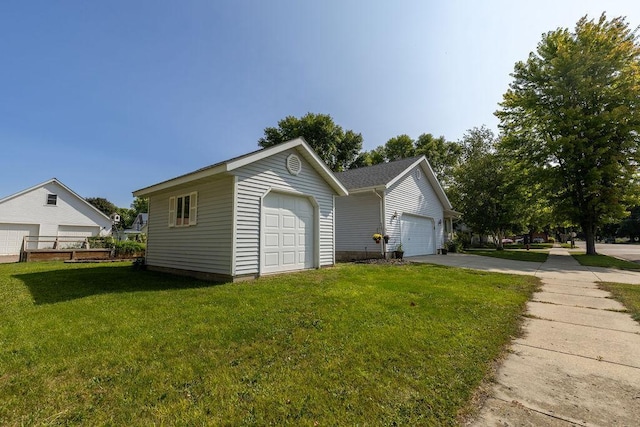 garage with a lawn