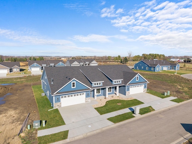 view of front of house with a garage and a front lawn