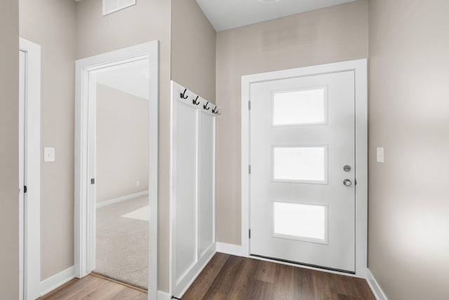 1003 11th Pl NW, Kasson, MN 55944 - doorway featuring wood finished floors and baseboards