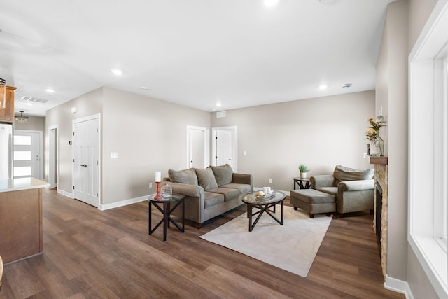 living room featuring dark wood-type flooring