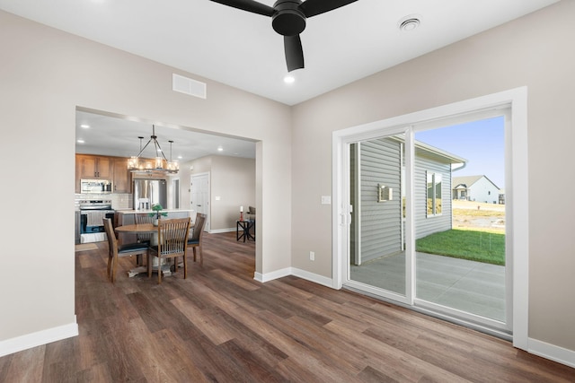 1003 11th Pl NW, Kasson, MN 55944 - dining room with dark wood-style floors, baseboards, a ceiling fan, recessed lighting, and a chandelier