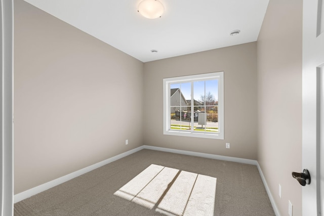 1003 11th Pl NW, Kasson, MN 55944 - empty room featuring carpet and baseboards