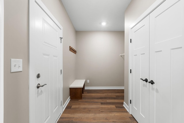 hall with dark hardwood / wood-style flooring