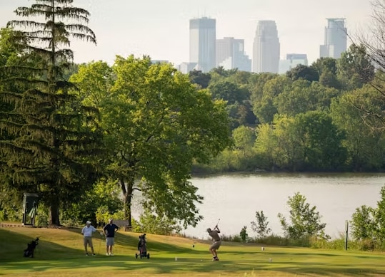 surrounding community with a lawn and a water view