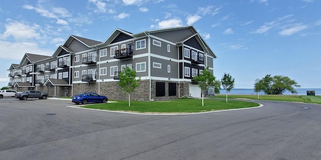 view of property with a water view