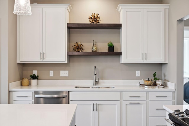 kitchen featuring stainless steel dishwasher, white cabinets, pendant lighting, and sink