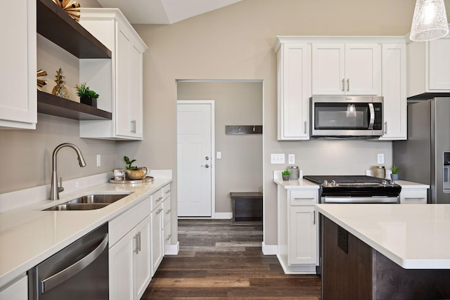 kitchen featuring dark wood-type flooring, white cabinets, appliances with stainless steel finishes, and sink