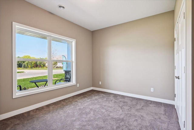 empty room with light colored carpet