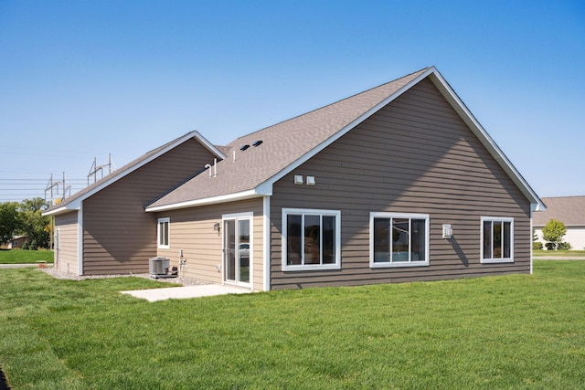 back of property with a lawn, a patio, and central air condition unit