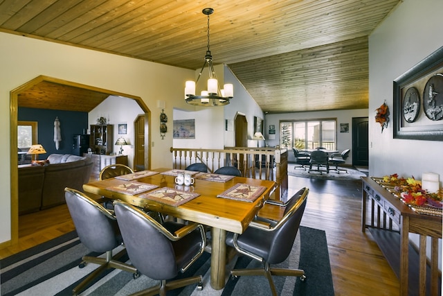 dining space featuring dark hardwood / wood-style flooring, a notable chandelier, vaulted ceiling, and wooden ceiling