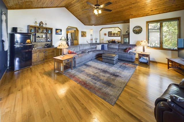 living room featuring ceiling fan, lofted ceiling, wood ceiling, and light hardwood / wood-style flooring