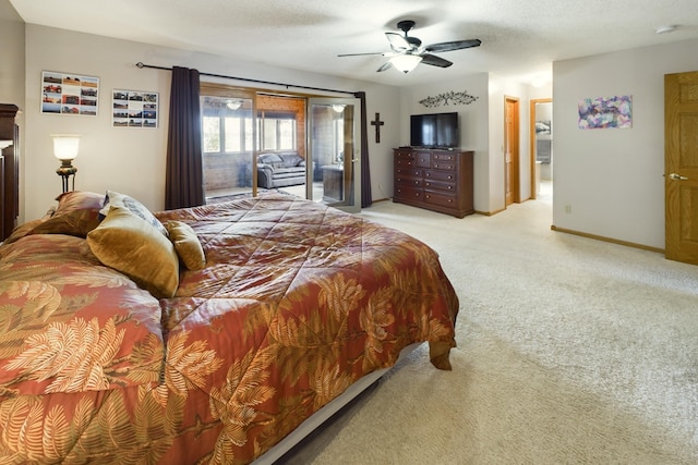 bedroom with a textured ceiling, access to outside, light colored carpet, and ceiling fan