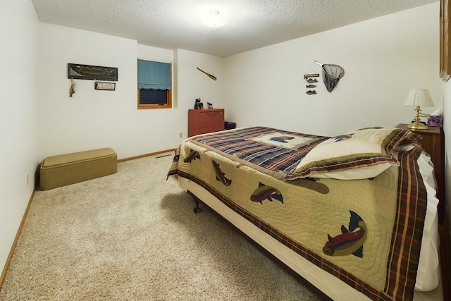 carpeted bedroom featuring a textured ceiling