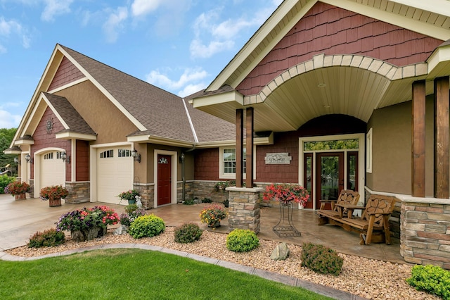 view of front of house with covered porch and a garage