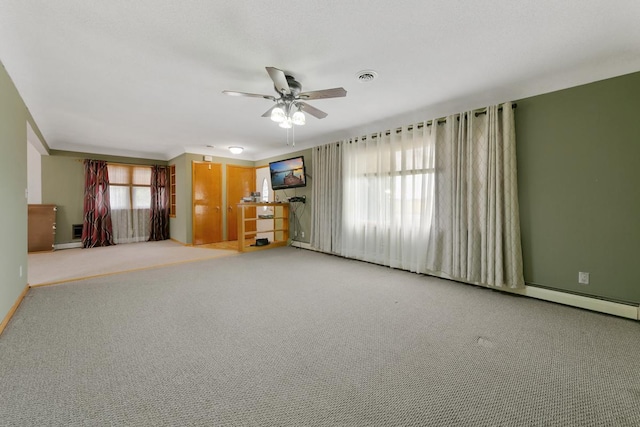 unfurnished living room with ceiling fan and light colored carpet