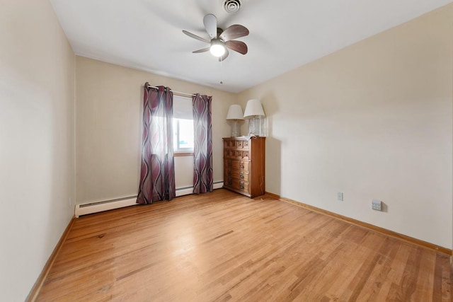 empty room featuring ceiling fan, a baseboard radiator, and light wood-type flooring