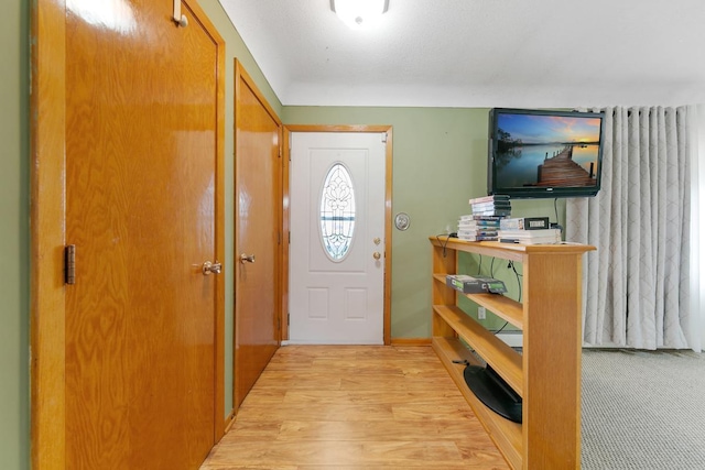 entryway with light hardwood / wood-style floors