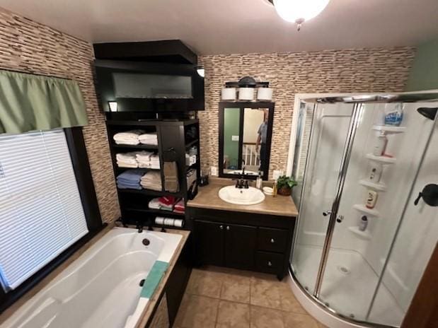 207 6th St, Montevideo, MN 56265 - bathroom with tile patterned floors, a shower stall, vanity, and a garden tub