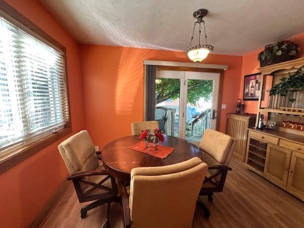 207 6th St, Montevideo, MN 56265 - dining room with wood finished floors and a dry bar